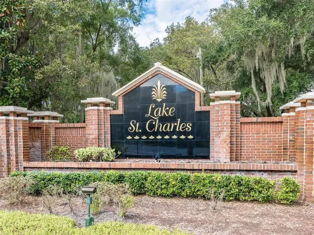 a view of a park with large trees