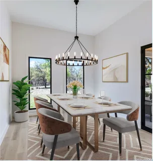 a kitchen with stainless steel appliances a stove refrigerator and cabinets
