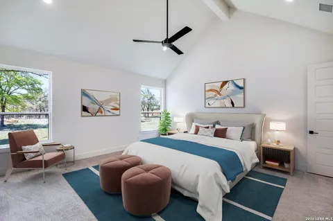 a view of an empty room with a ceiling fan