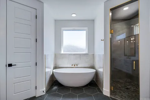 a kitchen with cabinets and white appliances