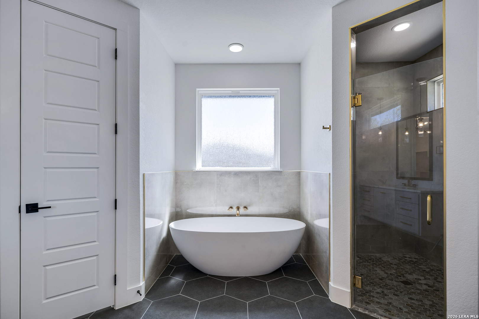 486 James Castroville, TX 78009 - Photo 17 of 29 a bathroom with a bathtub and shower