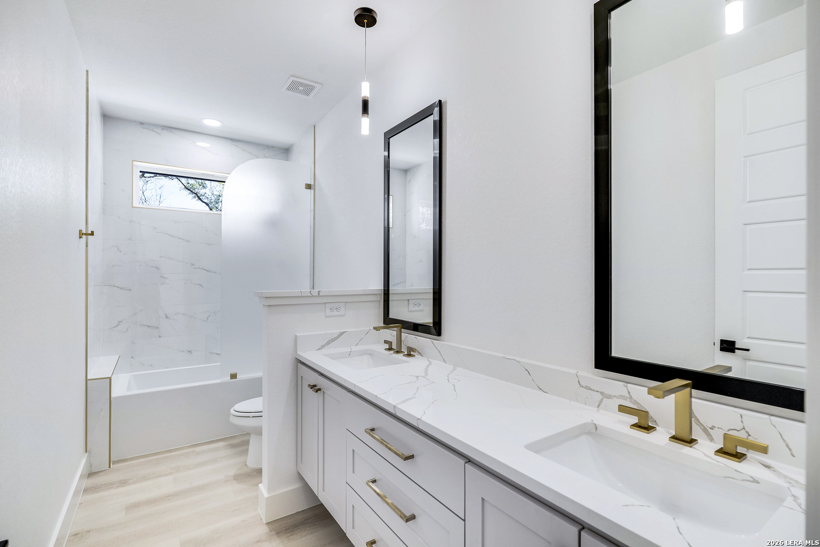 486 James Castroville, TX 78009 - Photo 24 of 29 a bathroom with a tub sink and mirror