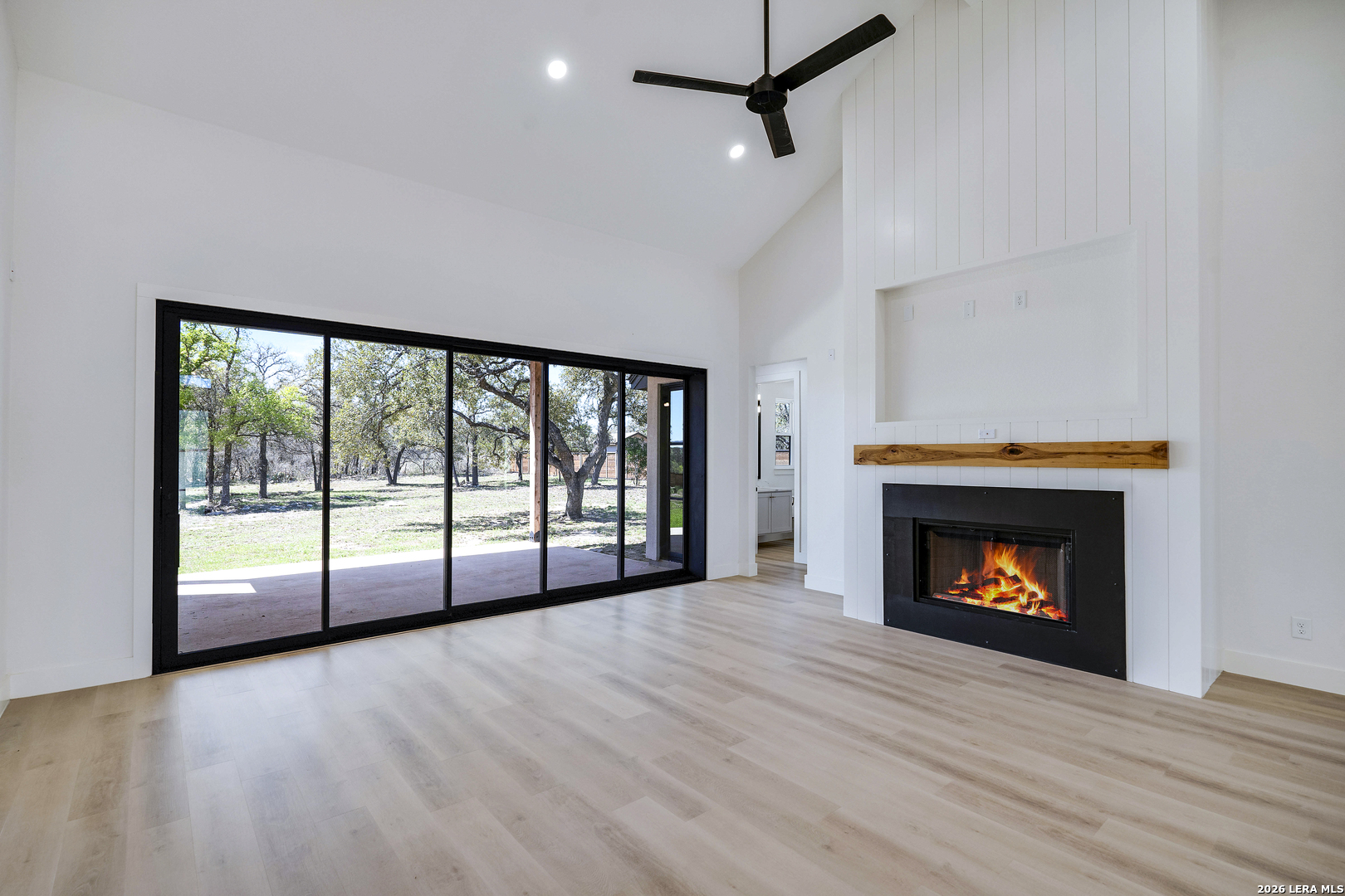 486 James Castroville, TX 78009 - Photo 9 of 29 a view of an empty room with a fireplace and window