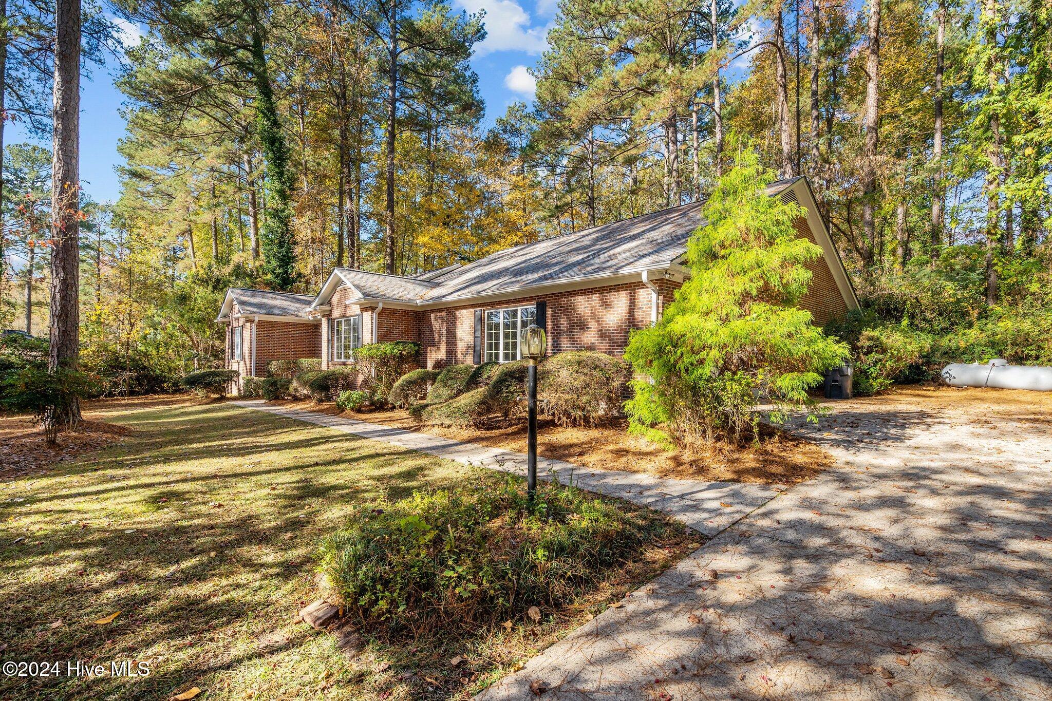 560 South Bethesda Road Southern Pines, NC 28387 - Photo 5 of 53 Most right side of front yard