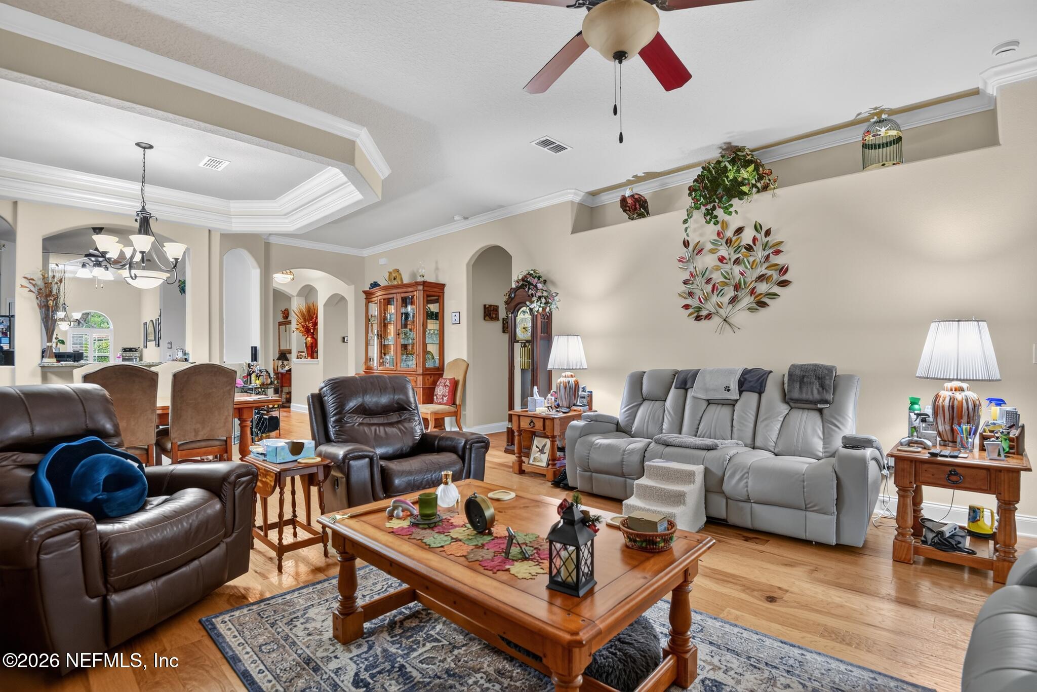 110 Vía Roma Ormond Beach, FL 32174 - Photo 10 of 43 a living room with furniture and a chandelier