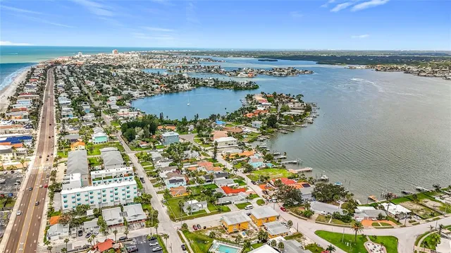 an aerial view of a residential houses with outdoor space