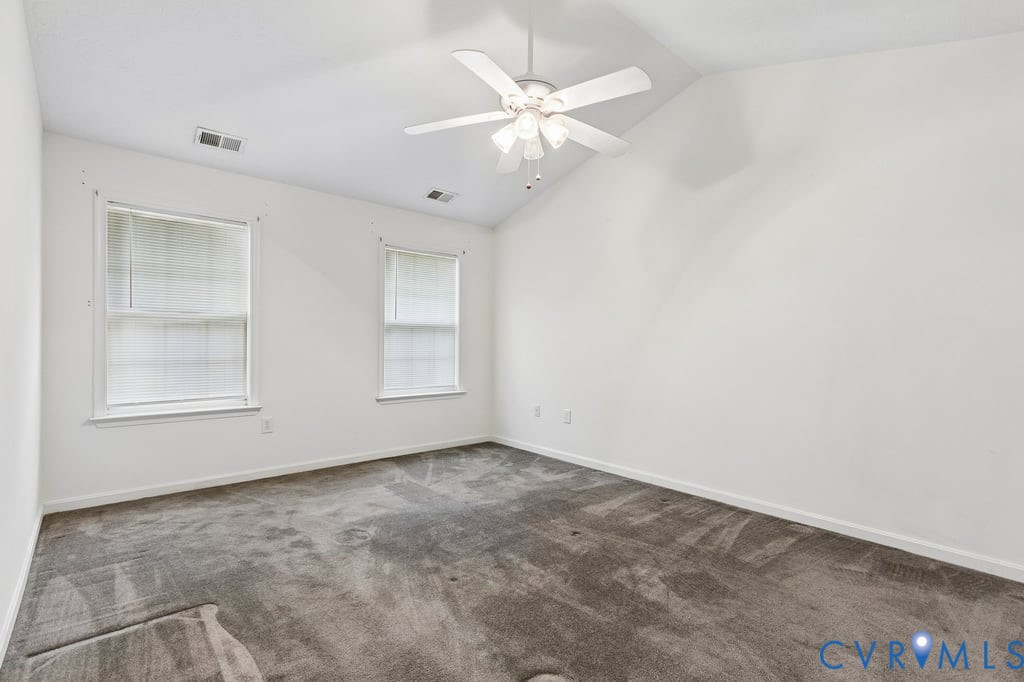 83 Albertson Court Ruther Glen, VA 22546 - Photo 15 of 25 Spacious room featuring vaulted ceilings, a ceilin