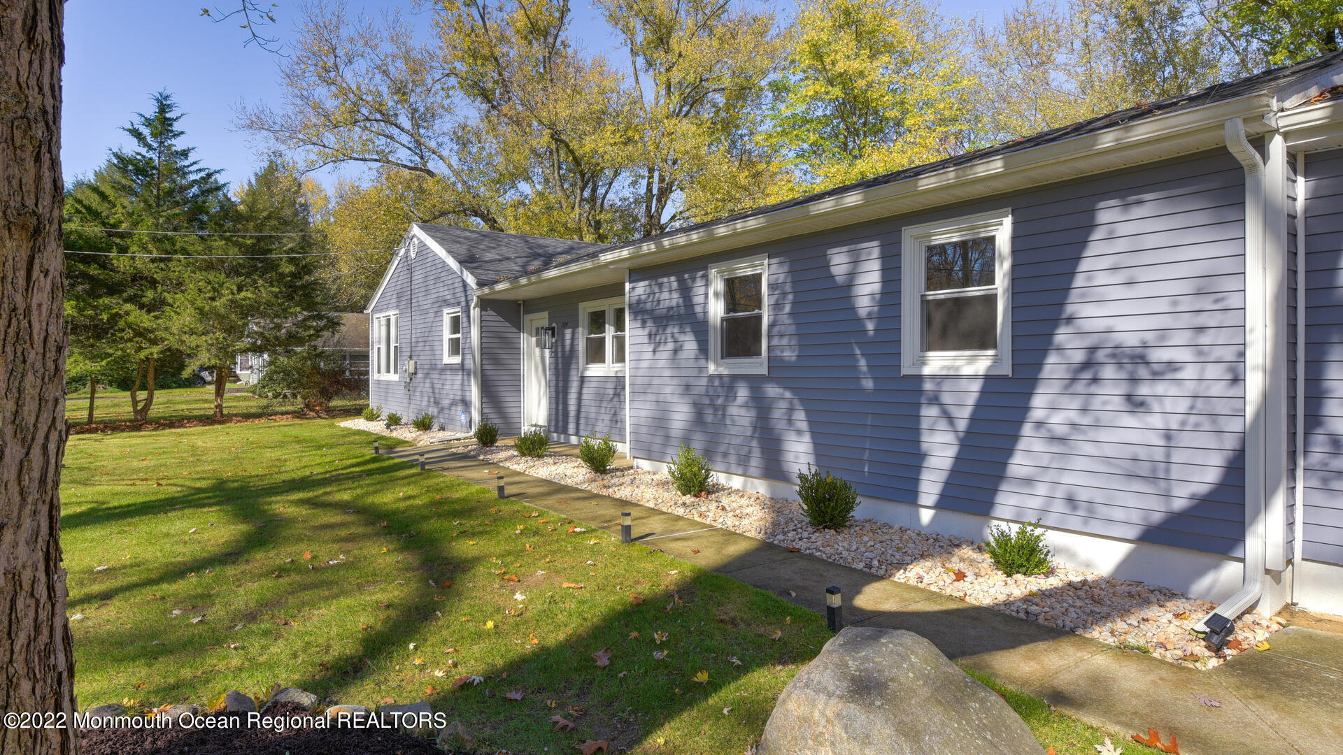 204 Paint Island Spring Road Millstone Township, NJ 08510 - Photo 2 of 30 a backyard of a house with outdoor seating