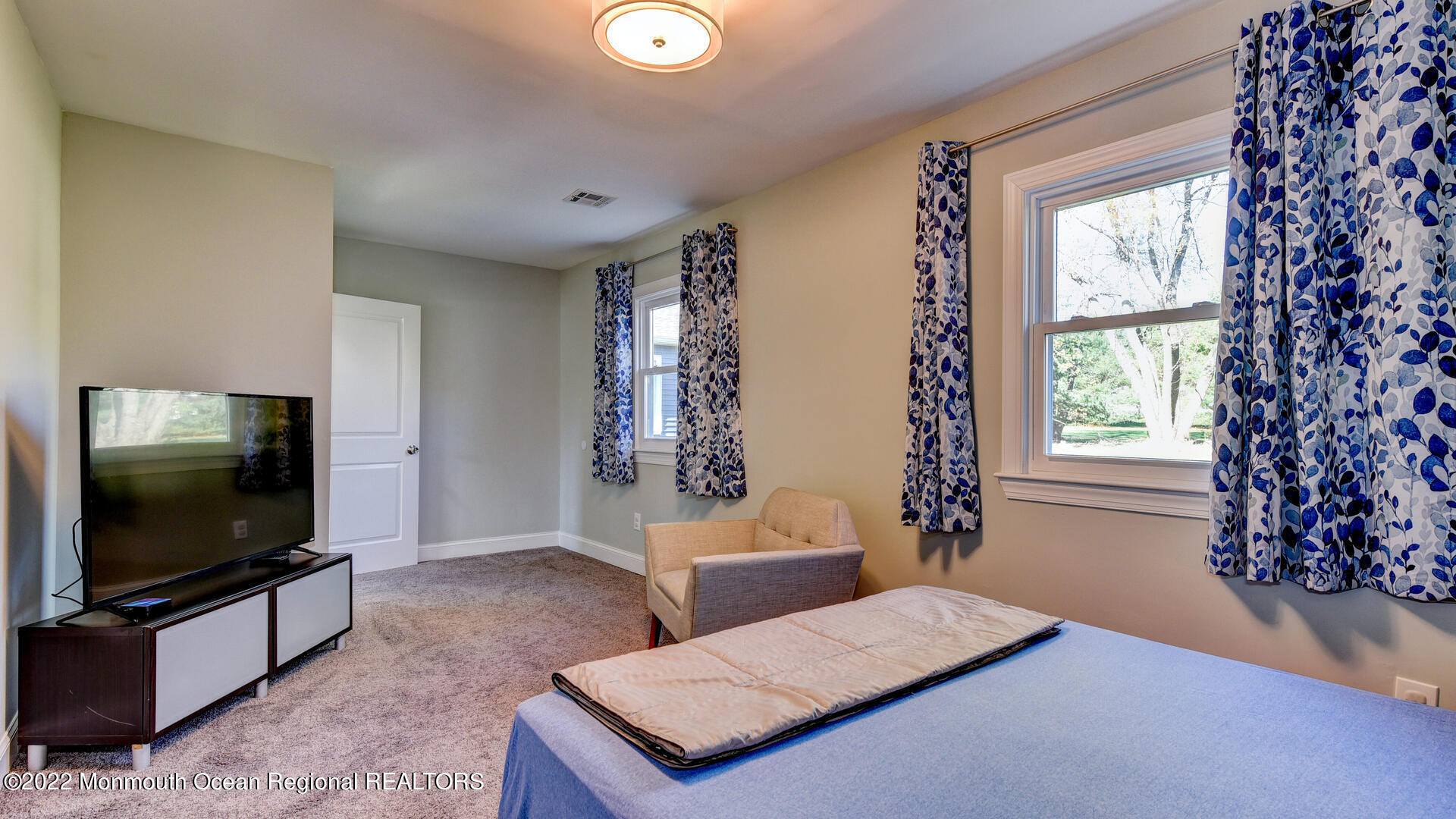 204 Paint Island Spring Road Millstone Township, NJ 08510 - Photo 23 of 30 a living room with furniture and a flat screen tv