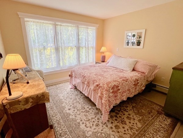 165 Christiantown Road West Tisbury, MA 02568 - Photo 7 of 8 a bedroom with a bed and wooden floor