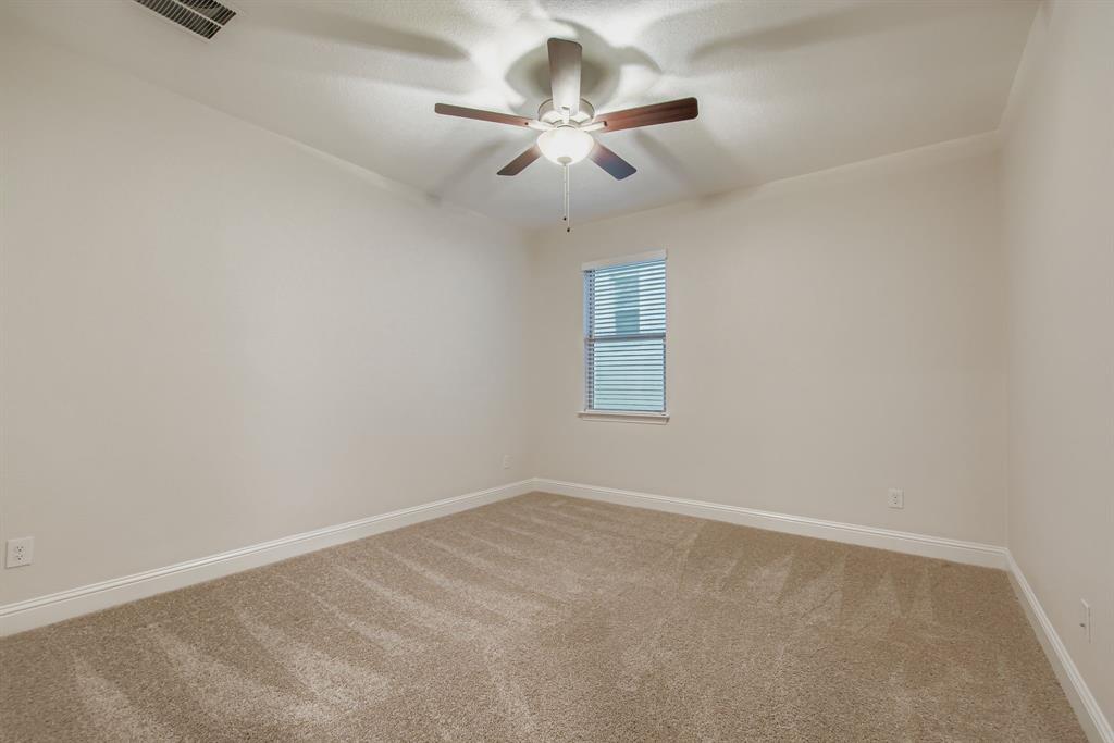 312 Magnolia Drive Oak Point, TX 75068 - Photo 16 of 28 Carpeted empty room featuring baseboards and ceiling fan
