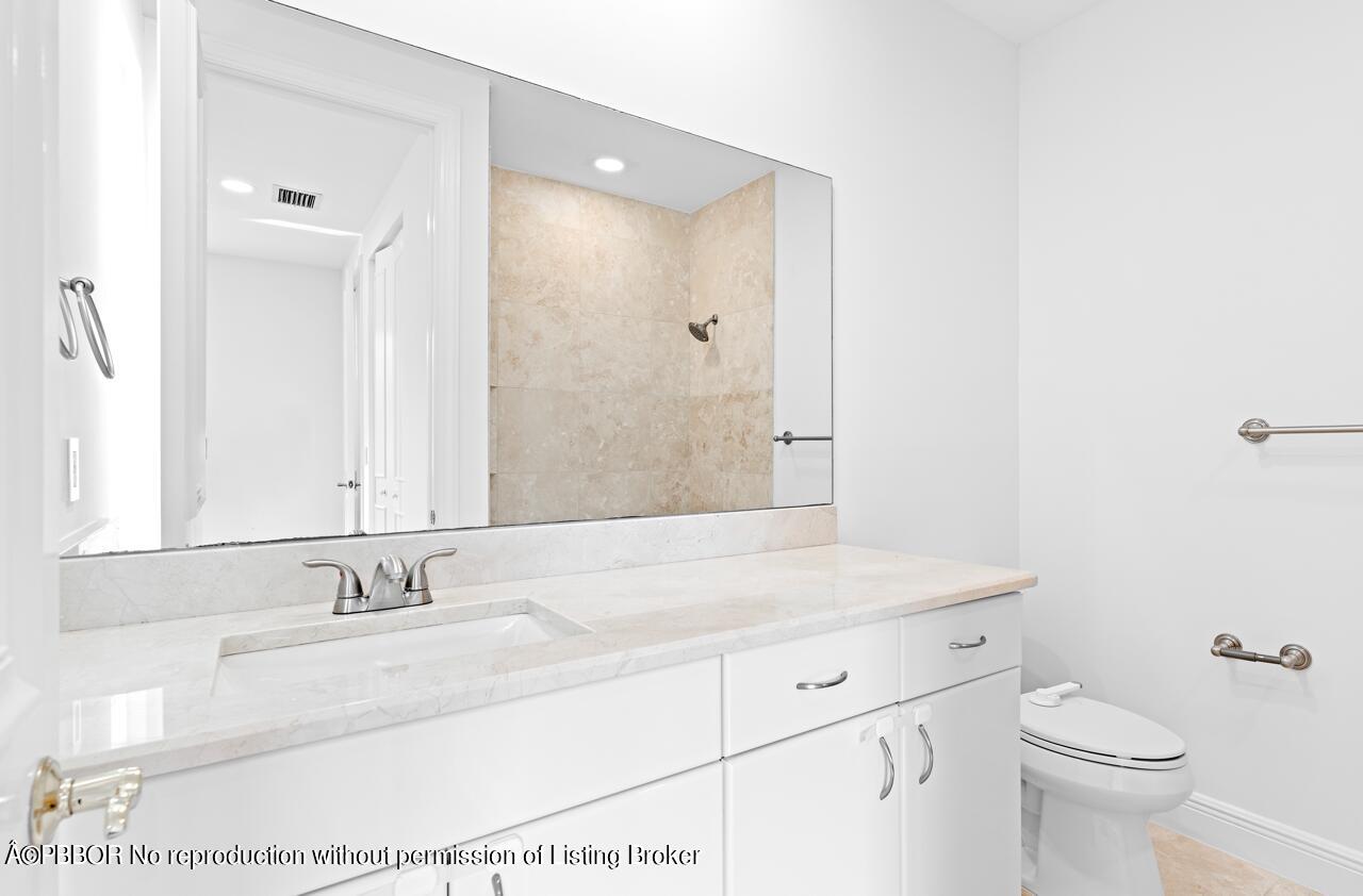 22771 El Dorado Drive Boca Raton, FL 33433 - Photo 13 of 24 a bathroom with a granite countertop sink and a mirror