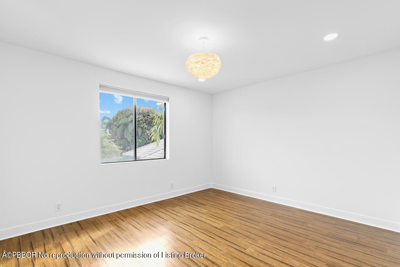 22771 El Dorado Drive Boca Raton, FL 33433 - Photo 19 of 24 an empty room with a window