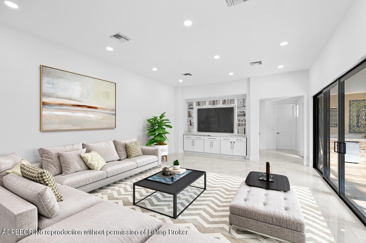 22771 El Dorado Drive Boca Raton, FL 33433 - Photo 2 of 24 a living room with furniture and a flat screen tv