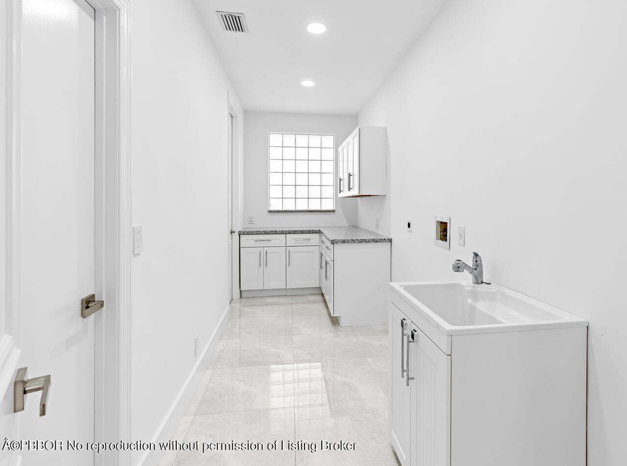 22771 El Dorado Drive Boca Raton, FL 33433 - Photo 21 of 24 a view of bathroom with dual sinks