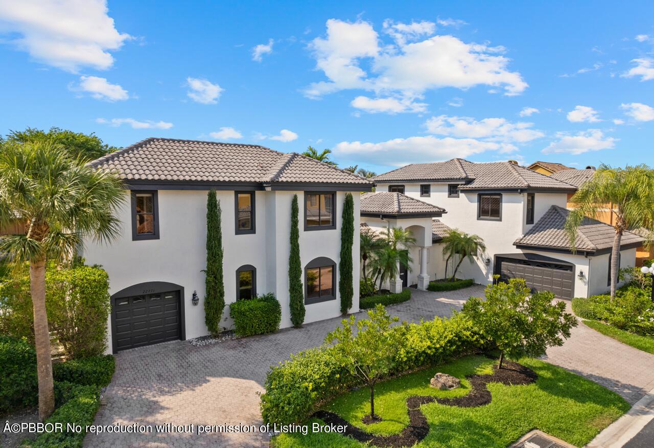 22771 El Dorado Drive Boca Raton, FL 33433 - Photo 3 of 24 a front view of a house with garden