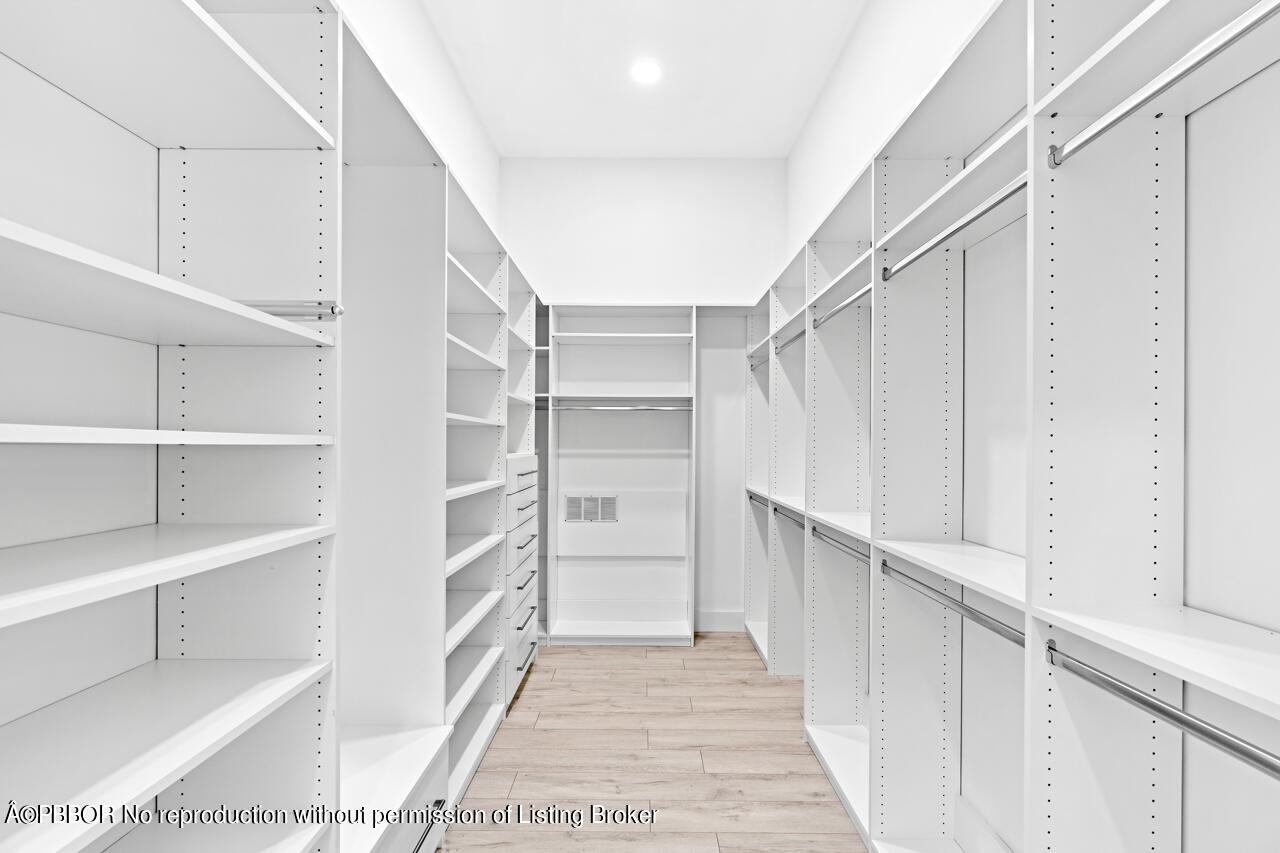 22771 El Dorado Drive Boca Raton, FL 33433 - Photo 8 of 24 a view of walk in closet with empty racks
