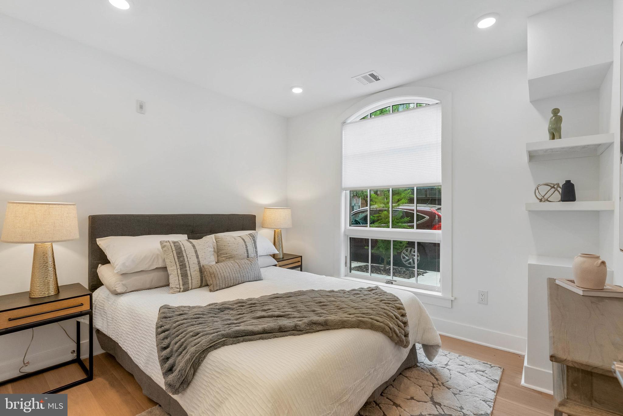 825 Bainbridge Street, Unit 101 Philadelphia, PA 19147 - Photo 13 of 27 a bedroom with a bed and a window