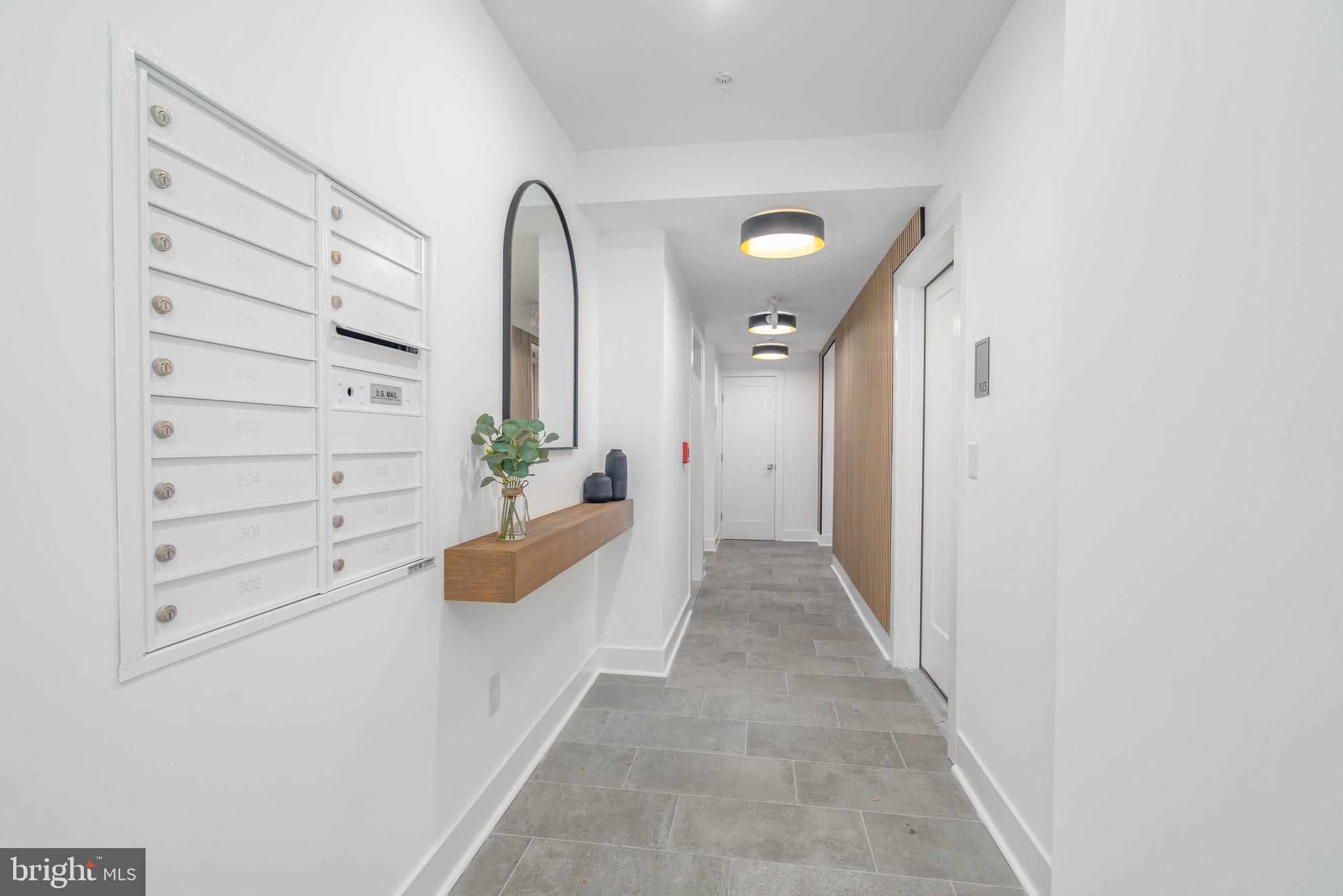 825 Bainbridge Street, Unit 101 Philadelphia, PA 19147 - Photo 22 of 27 a view of entryway with wooden floor
