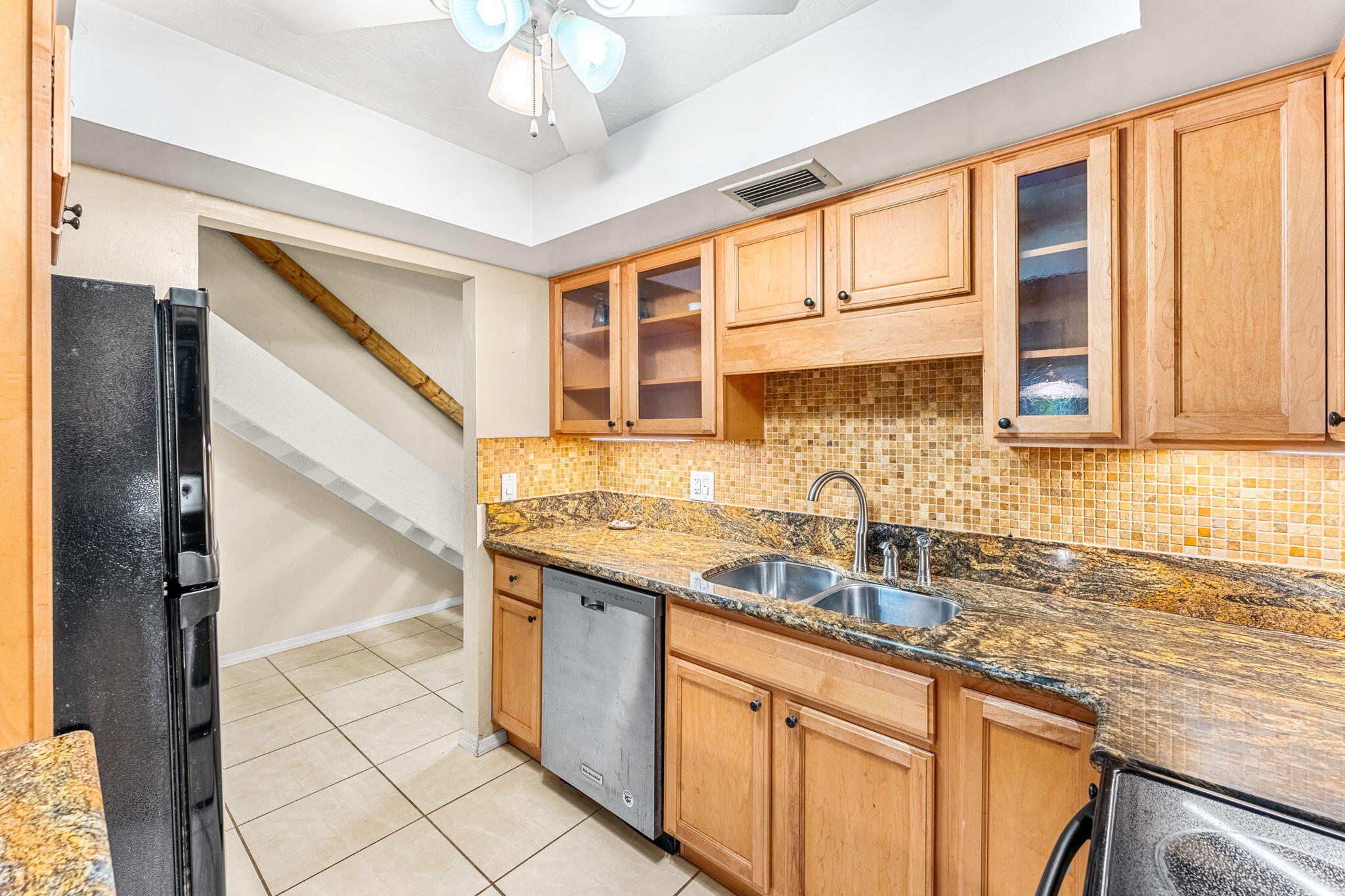 3 Cove Road, Unit 3 Melbourne Beach, FL 32951 - Photo 11 of 40 a kitchen with stainless steel appliances granite countertop a sink and a cabinets