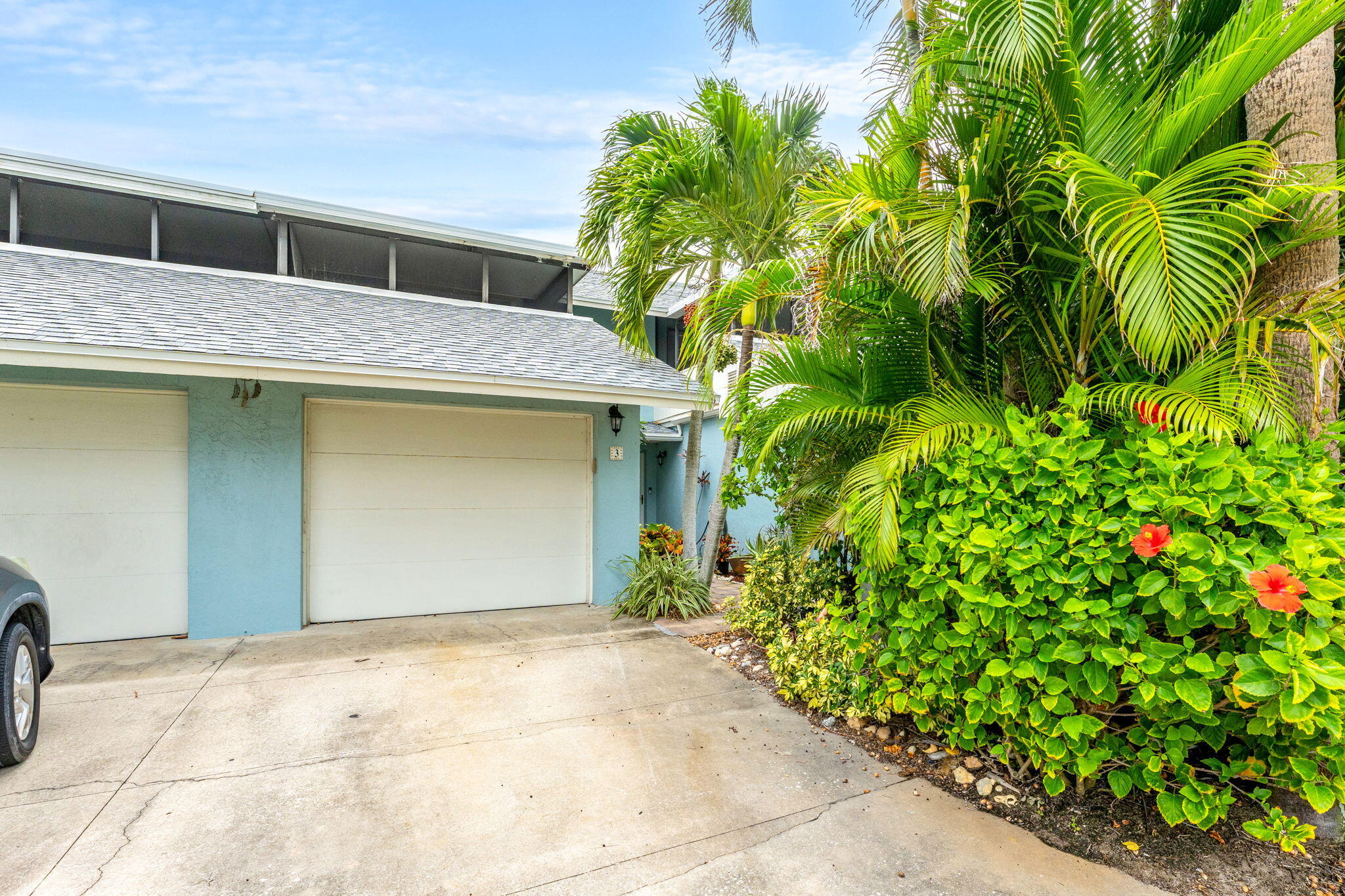 3 Cove Road, Unit 3 Melbourne Beach, FL 32951 - Photo 2 of 40 a view of a house with a yard and plant
