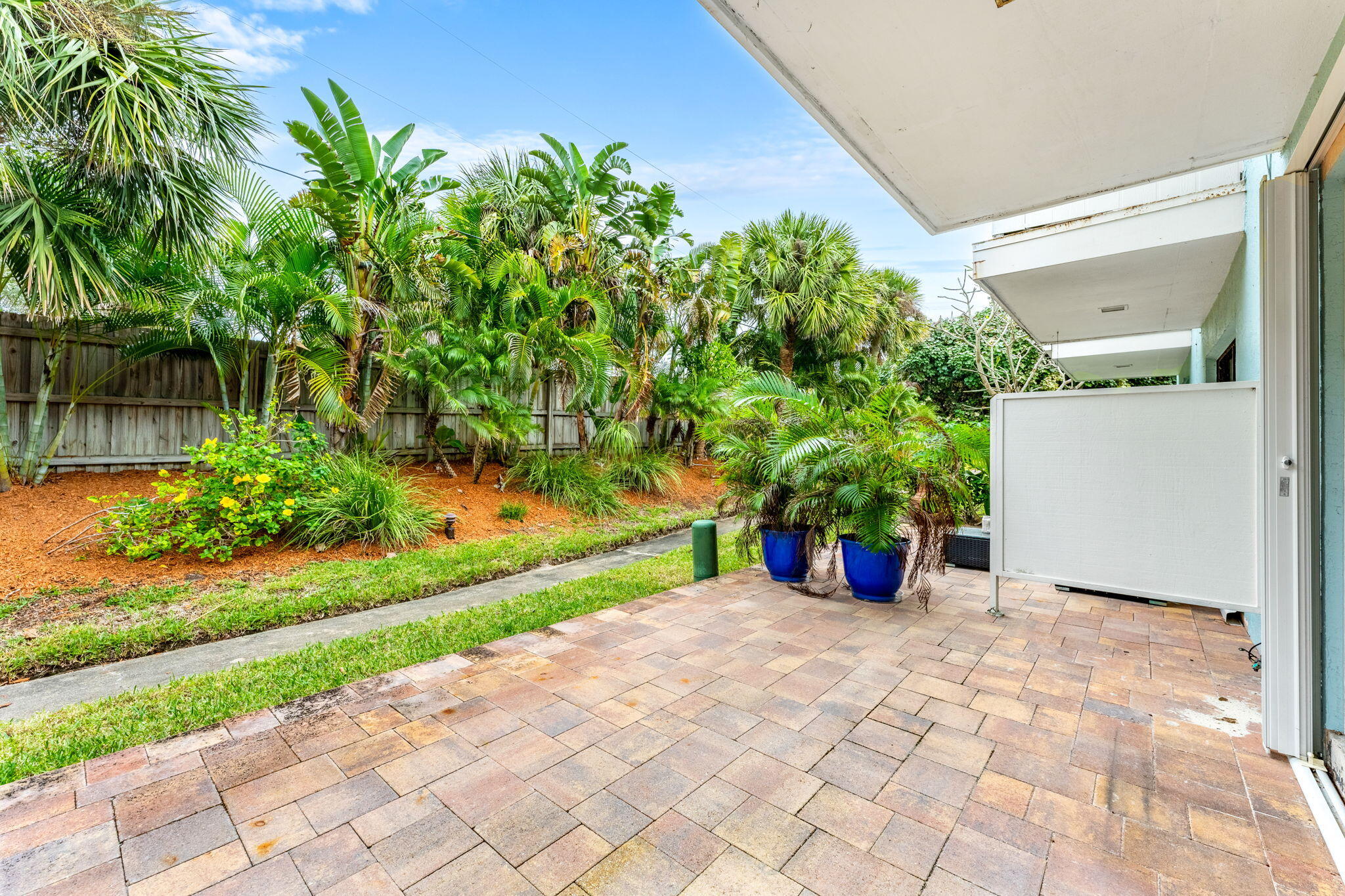 3 Cove Road, Unit 3 Melbourne Beach, FL 32951 - Photo 36 of 40 a front view of a house with a yard