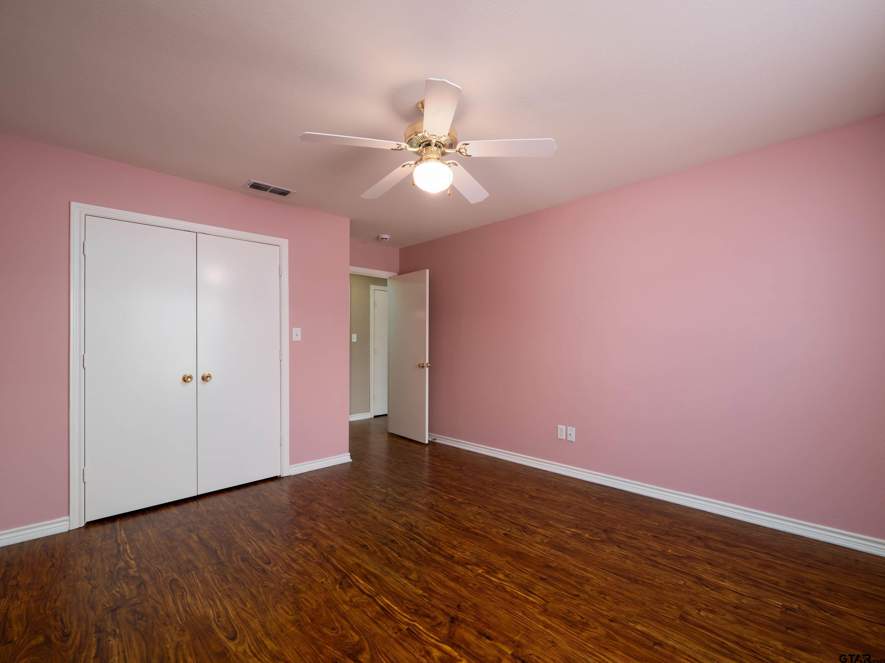 1521 Rice Road Tyler, TX 75703 - Photo 21 of 23 a view of an empty room with wooden floor