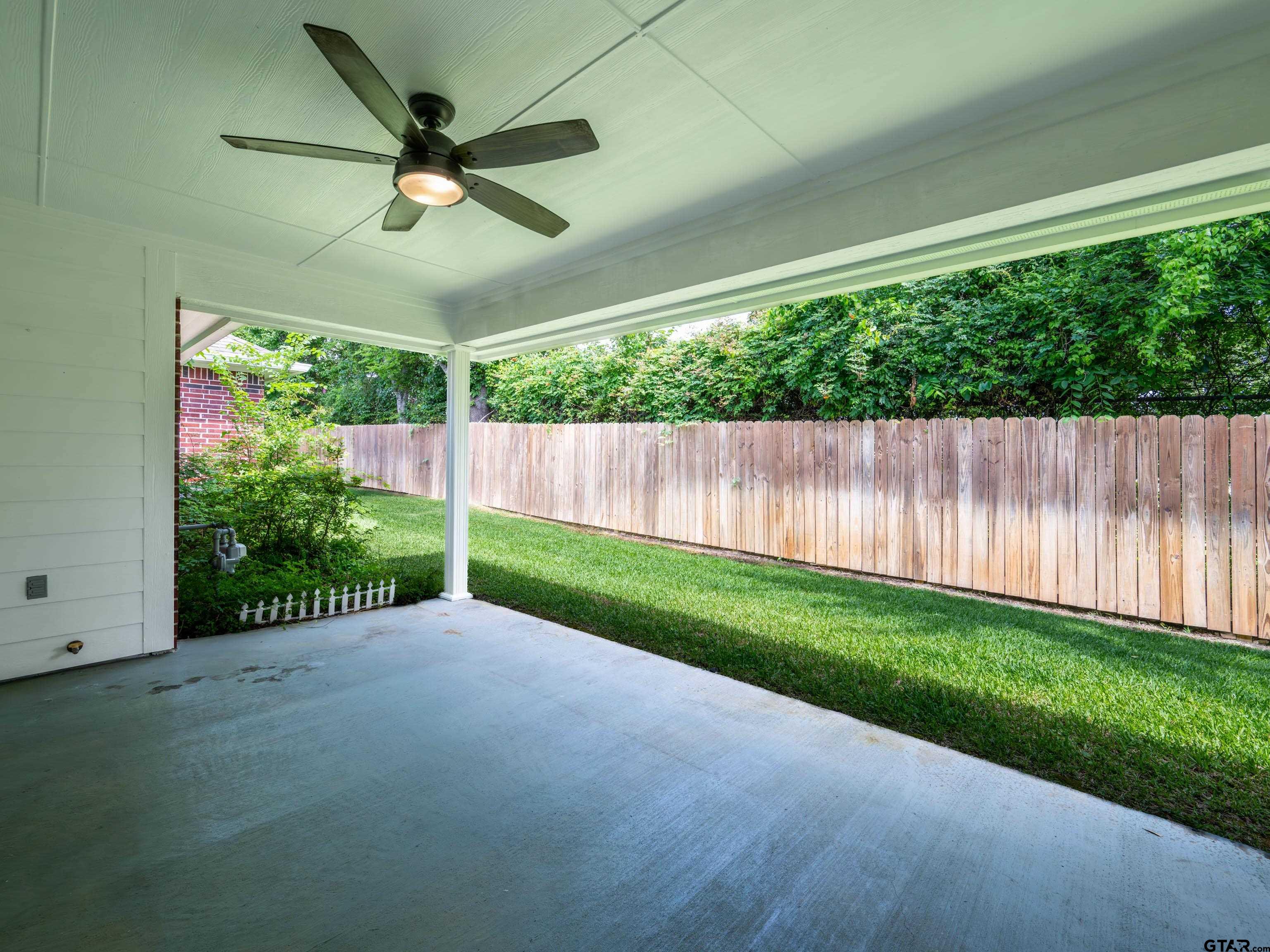 1521 Rice Road Tyler, TX 75703 - Photo 22 of 23 a view of a yard with wooden floor
