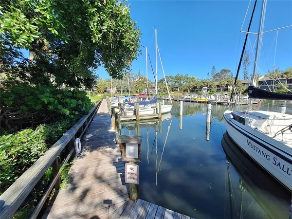 a view of a balcony with two chairs