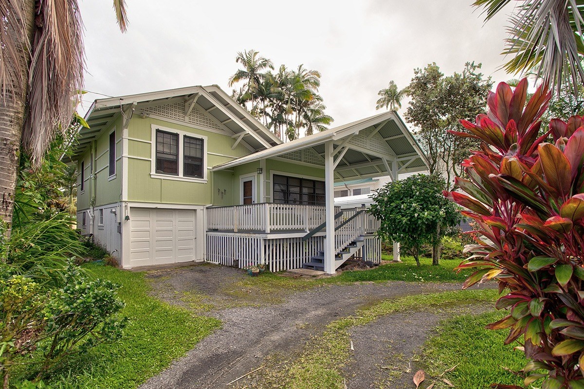 197 Kaiulani Street Hilo, HI 96720 - Photo 1 of 24 a view of a house with a yard and plants