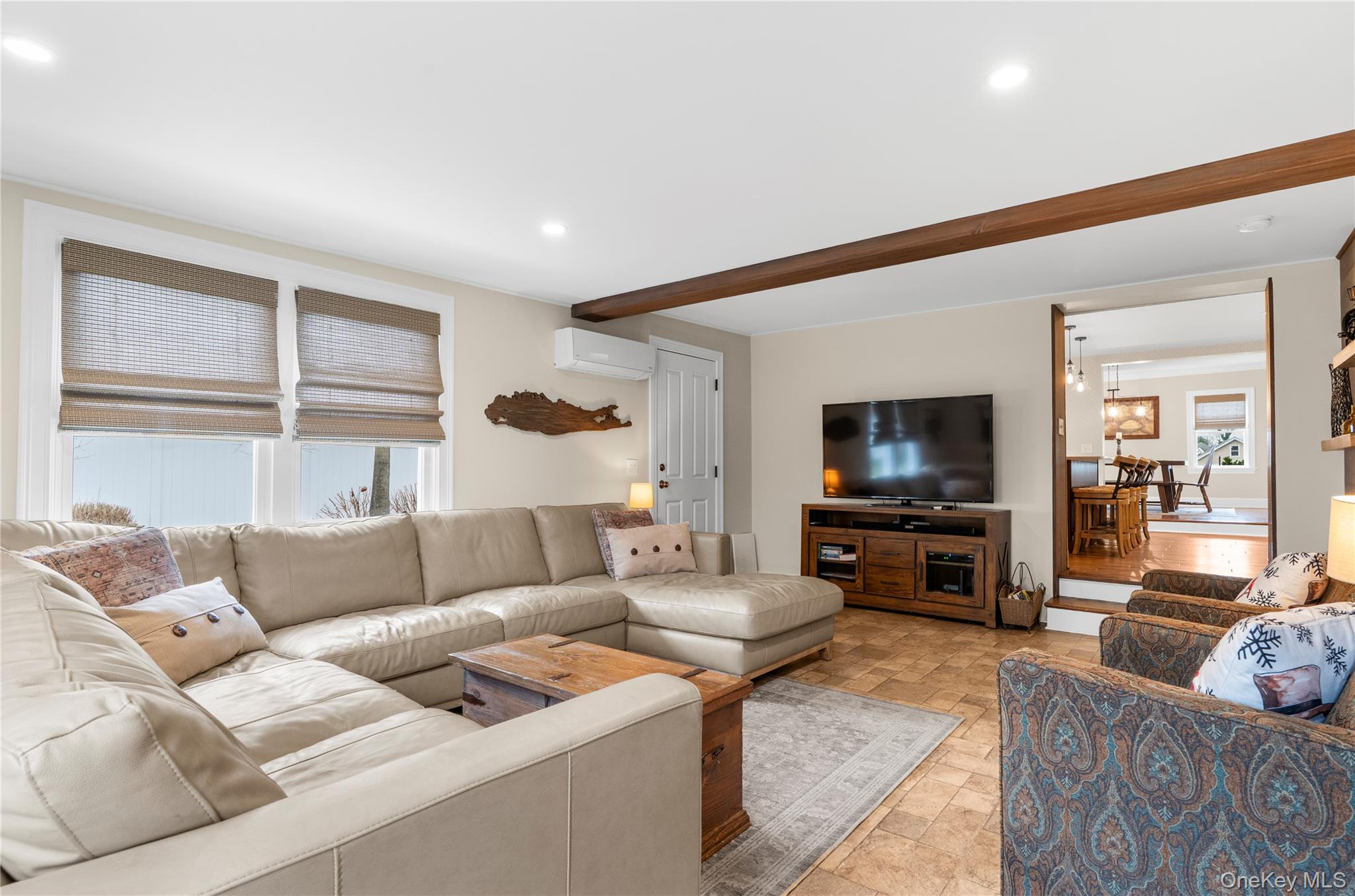 117 Union Avenue Islip, NY 11751 - Photo 14 of 33 a living room with furniture and a flat screen tv