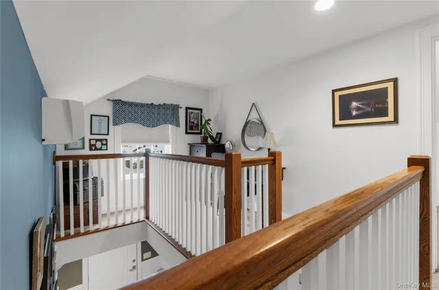 a bedroom with a large bed and a large window