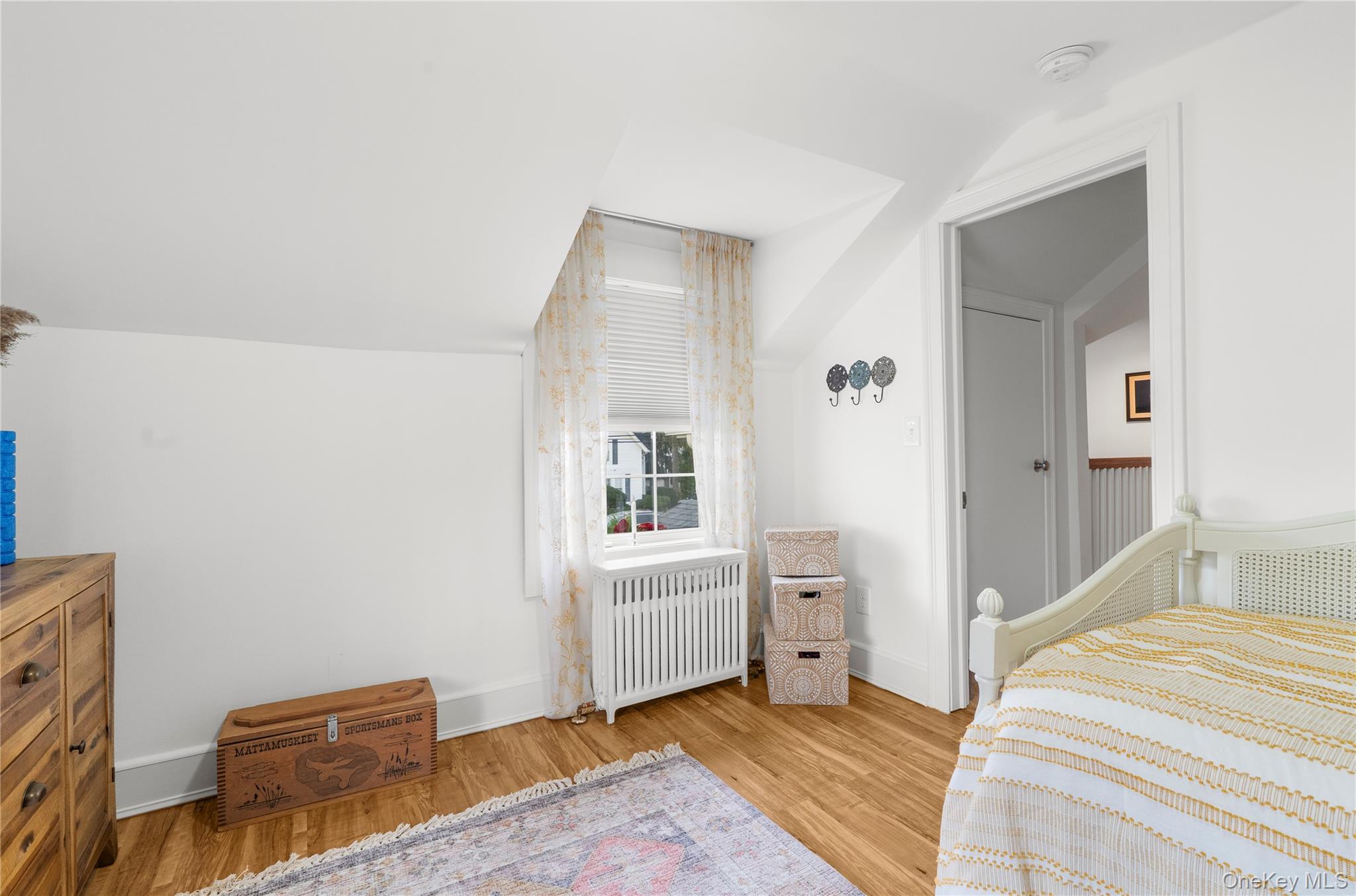 117 Union Avenue Islip, NY 11751 - Photo 29 of 33 a bedroom with a bed and a window