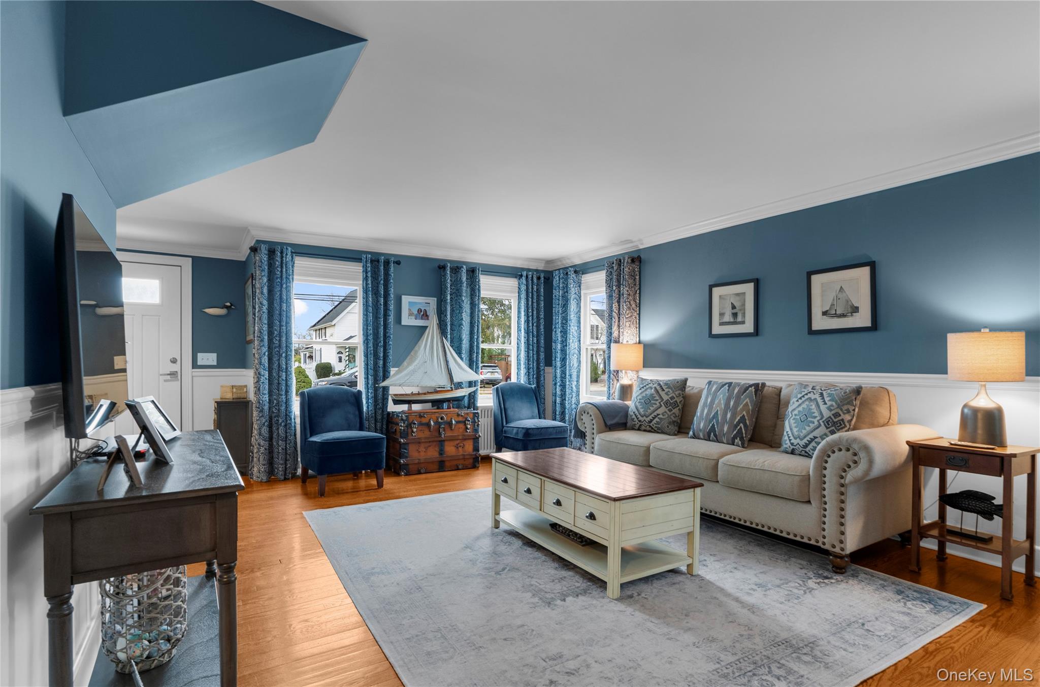 117 Union Avenue Islip, NY 11751 - Photo 6 of 33 a living room with furniture and a potted plant
