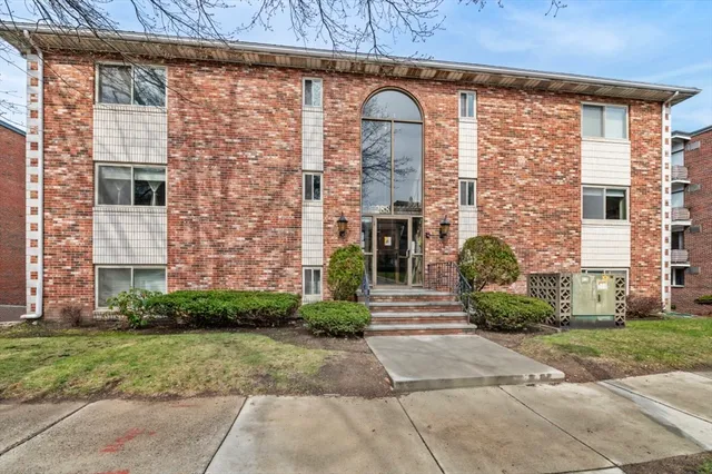 a view of a hallway with bathroom