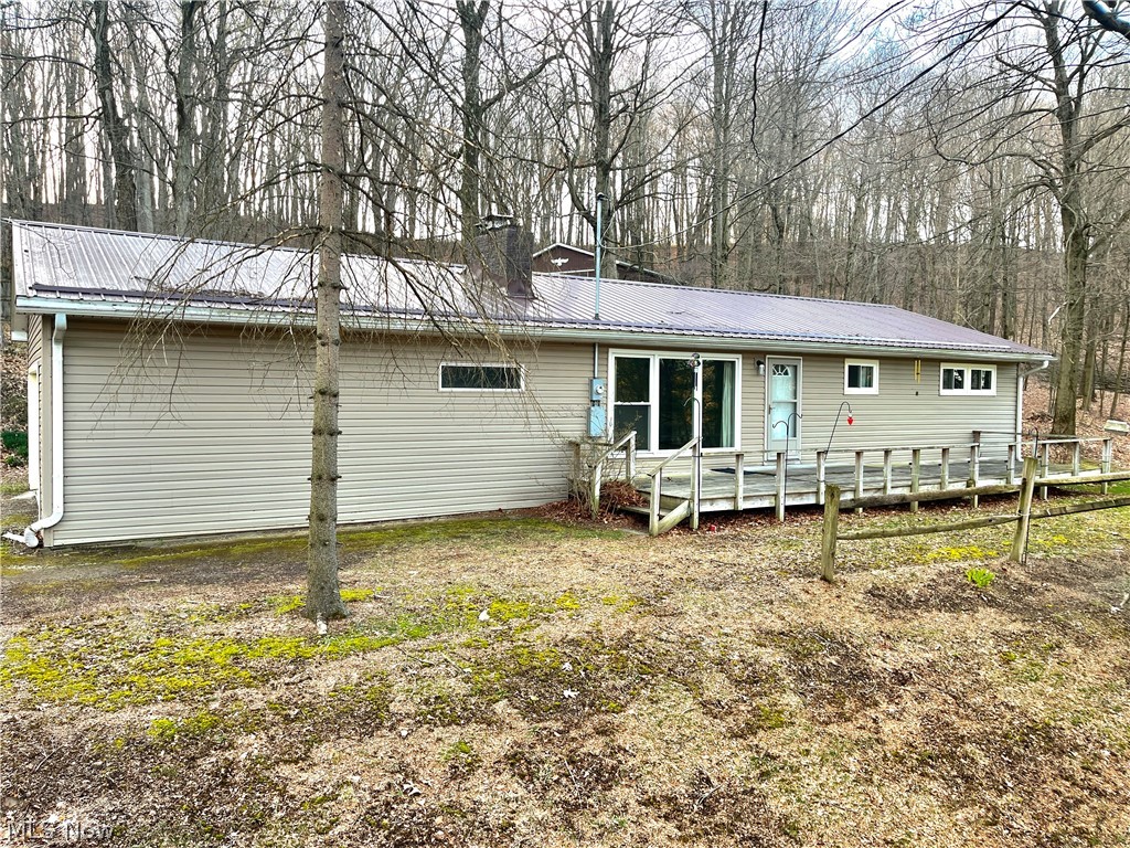 6198 Arrow Road Northwest Minerva, OH 44657 - Photo 1 of 17 Rear view of property with a deck