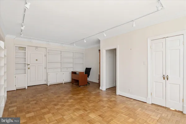 a view of workspace with furniture and window