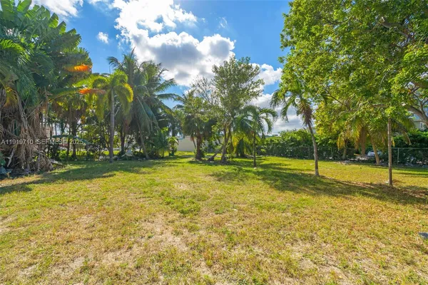 a view of a swimming pool with an outdoor space and seating area