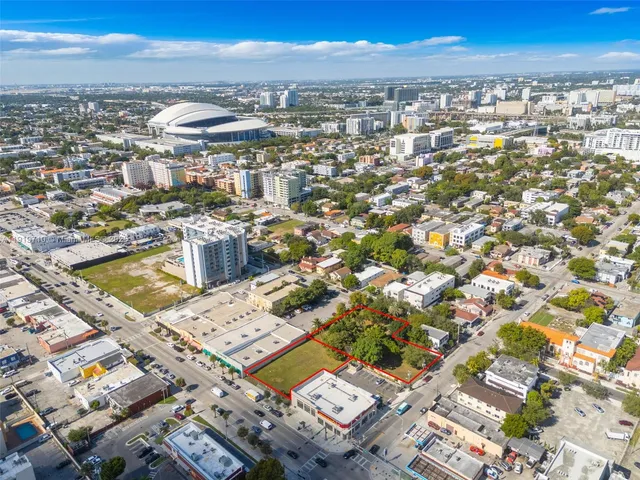 an aerial view of a city with ocean