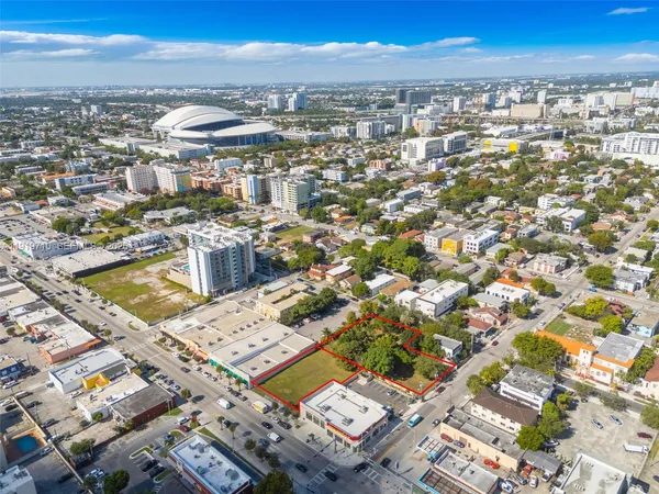 an aerial view of a city with ocean