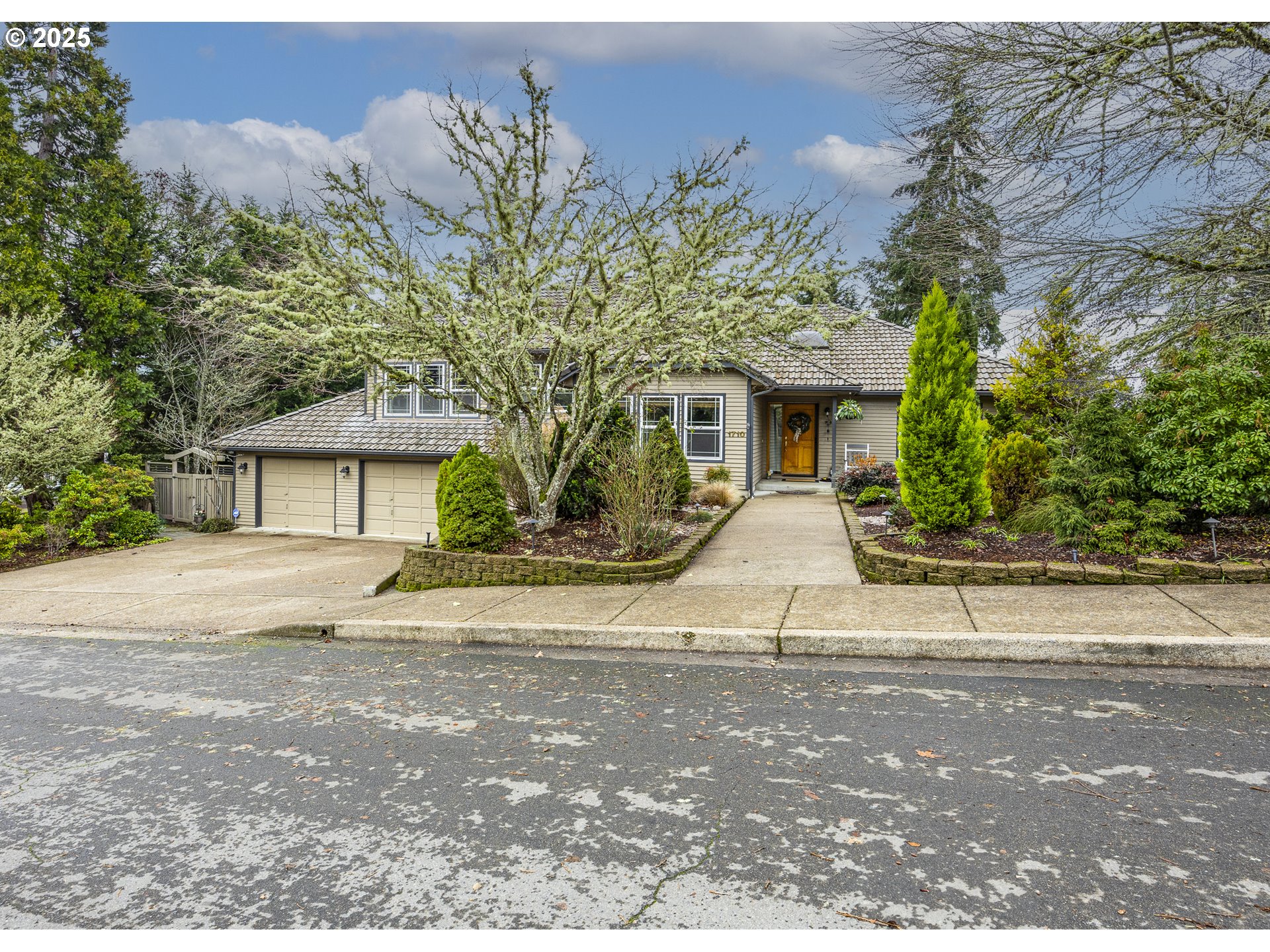 1710 White Oak Drive Eugene, OR 97405 - Photo 2 of 45 a white house that has a tree in front of it