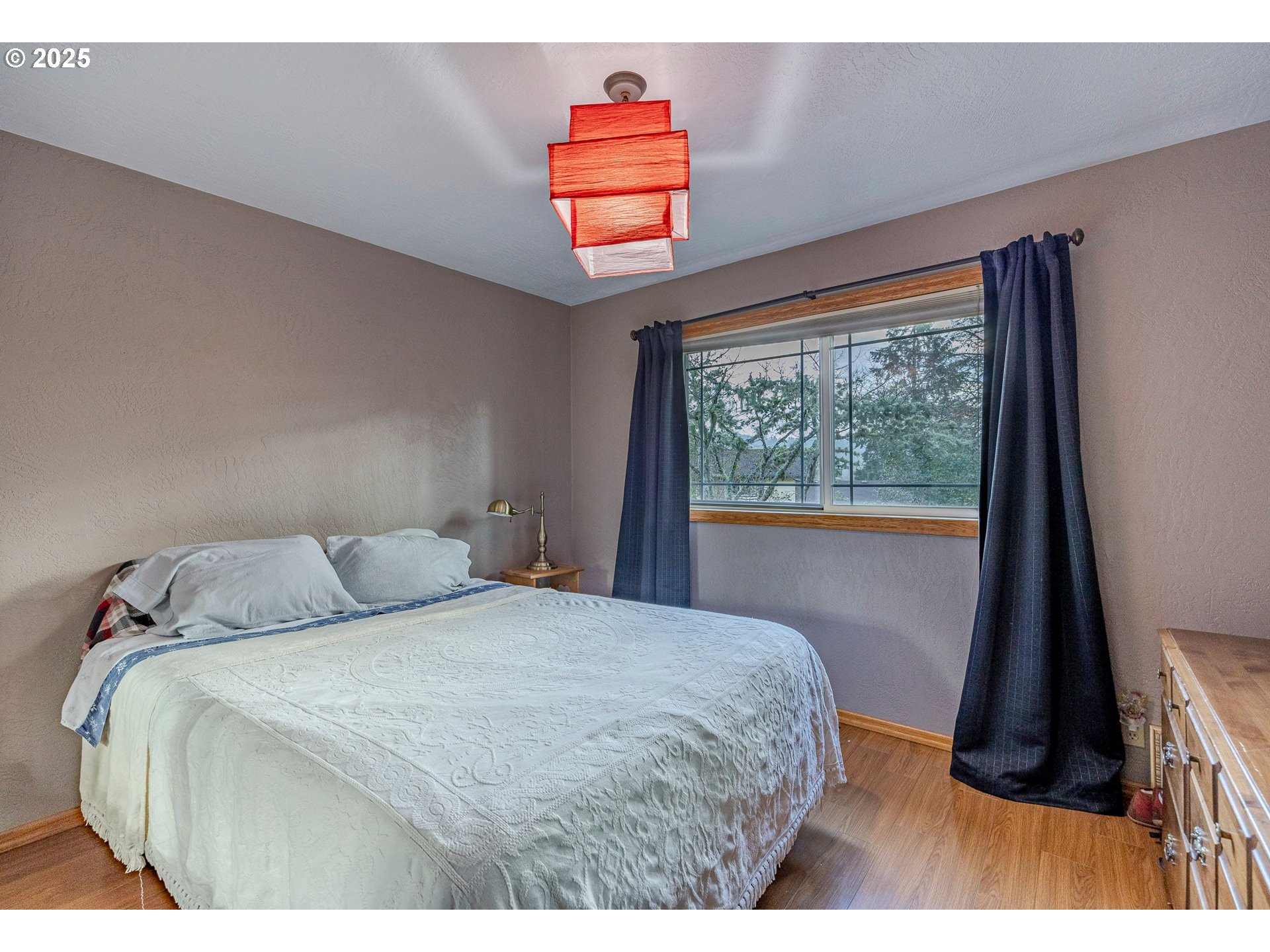1710 White Oak Drive Eugene, OR 97405 - Photo 35 of 45 a bedroom with a bed and a window