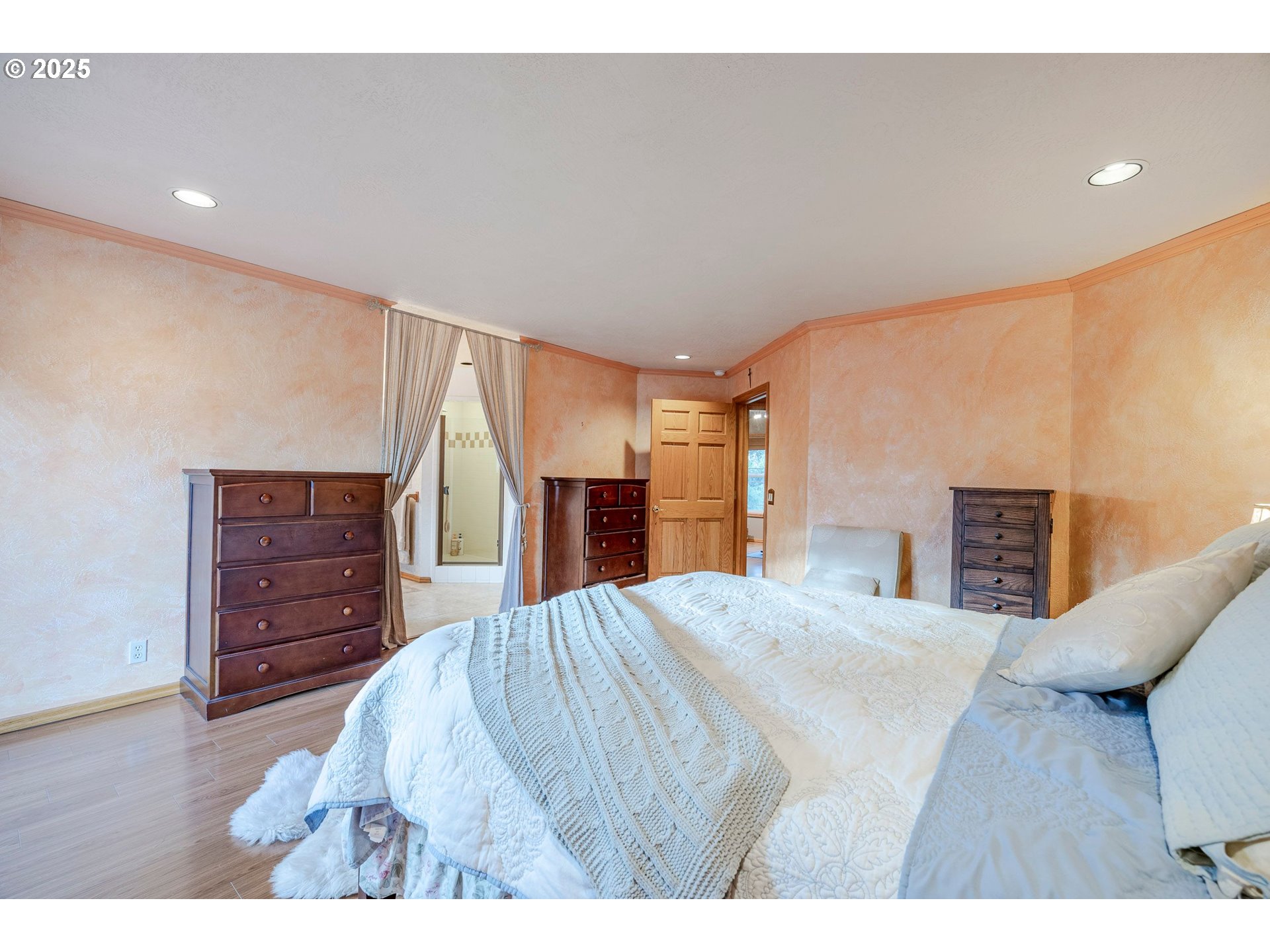 1710 White Oak Drive Eugene, OR 97405 - Photo 40 of 45 a bedroom with a bed and wooden floor