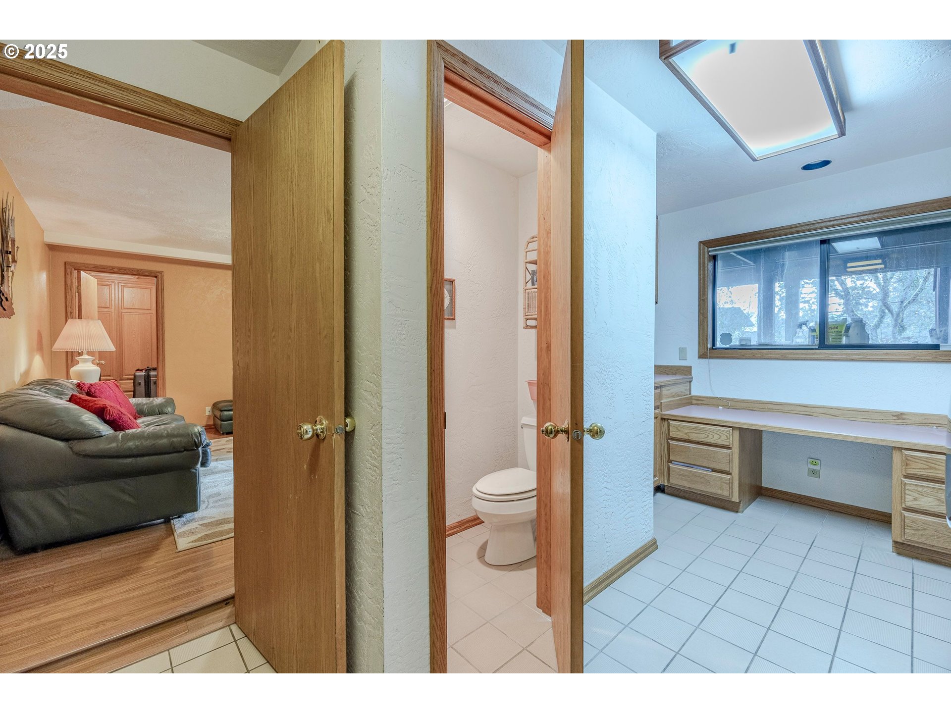 1710 White Oak Drive Eugene, OR 97405 - Photo 45 of 45 a bathroom with a toilet a sink and a mirror