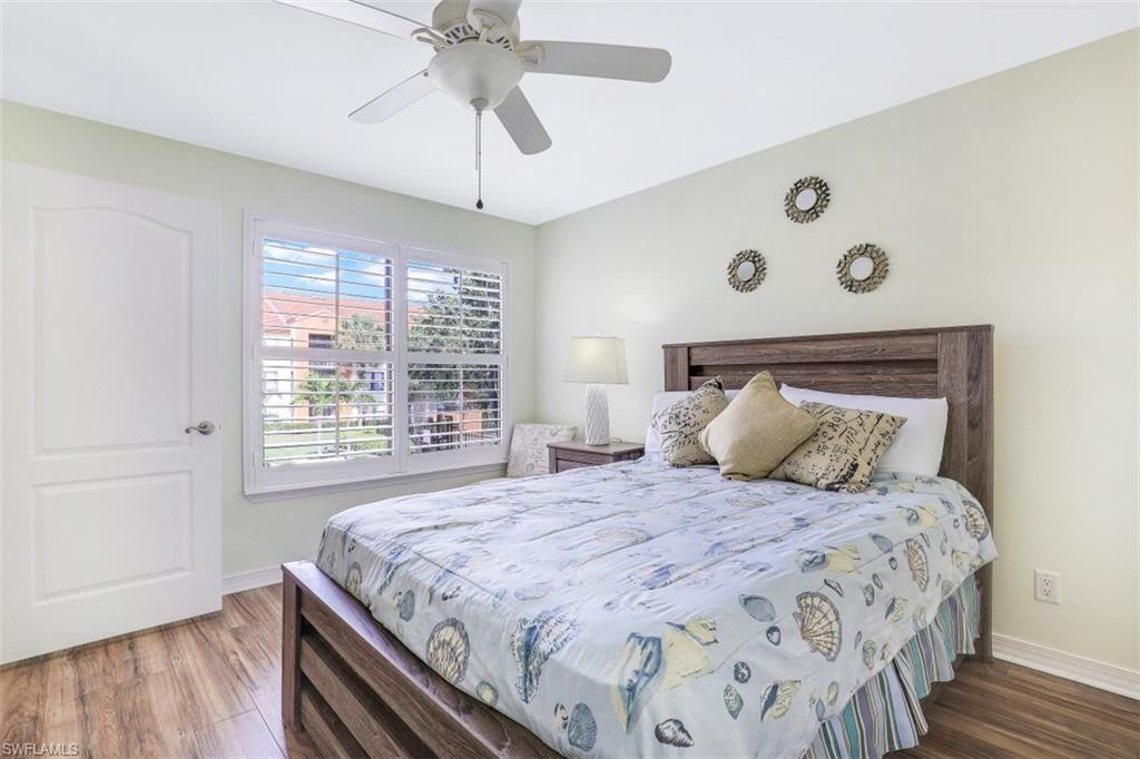 13621 Eagle Ridge Drive, Unit 1522 Fort Myers, FL 33912 - Photo 14 of 22 a bedroom with a large bed and a window