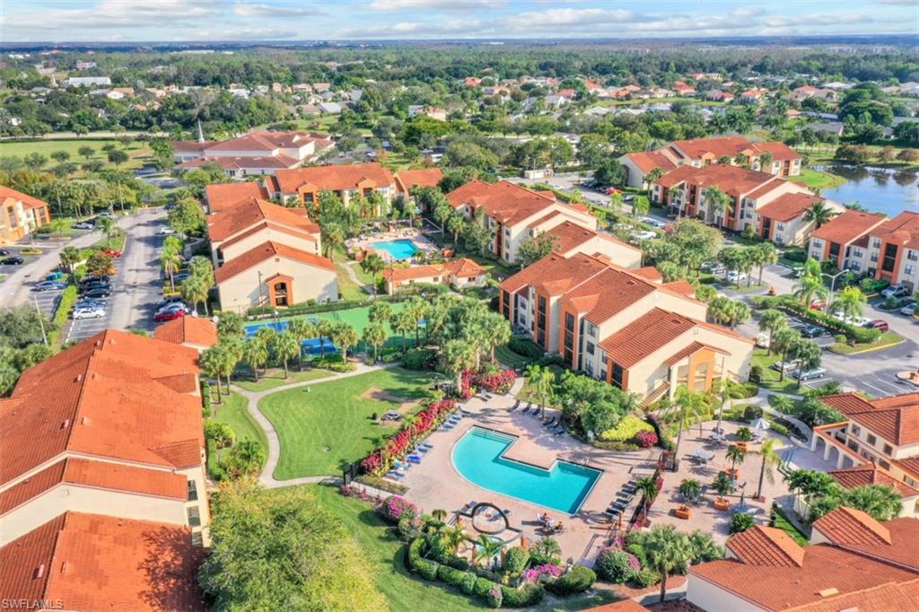 13621 Eagle Ridge Drive, Unit 1522 Fort Myers, FL 33912 - Photo 3 of 22 an aerial view of residential houses with outdoor space and river view