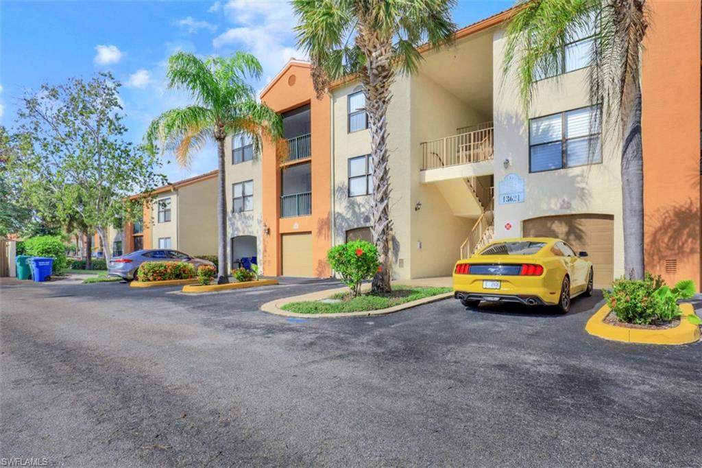 13621 Eagle Ridge Drive, Unit 1522 Fort Myers, FL 33912 - Photo 4 of 22 a car parked in front of a building