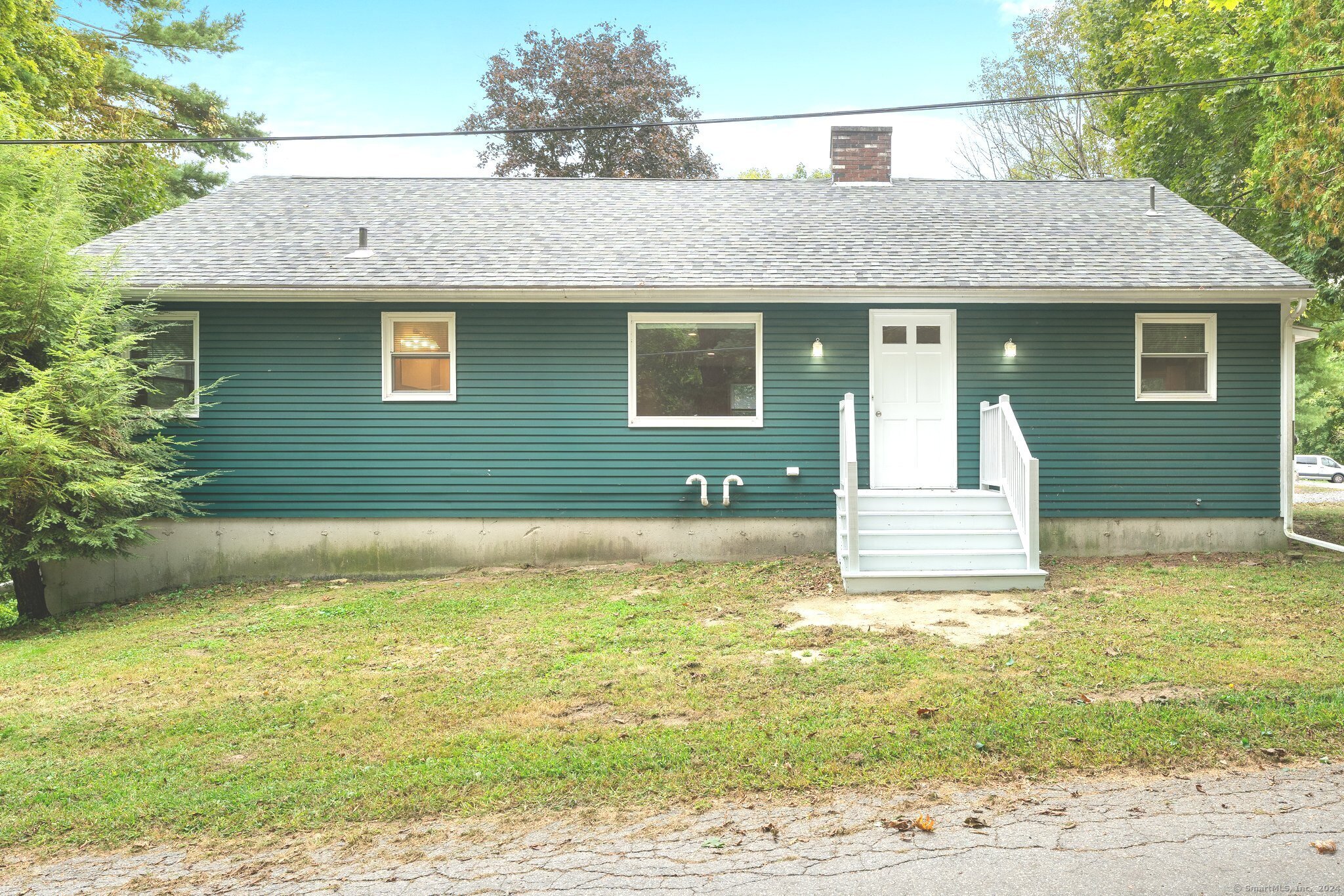 a front view of a house with a yard