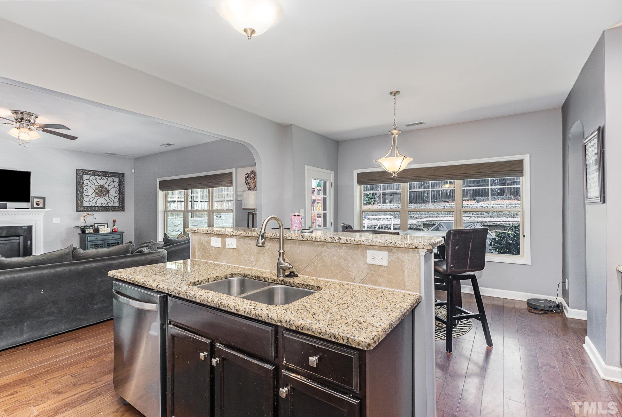 1604 Hauser Lake Road Knightdale, NC 27545 - Photo 12 of 32 a kitchen with center island table and chairs