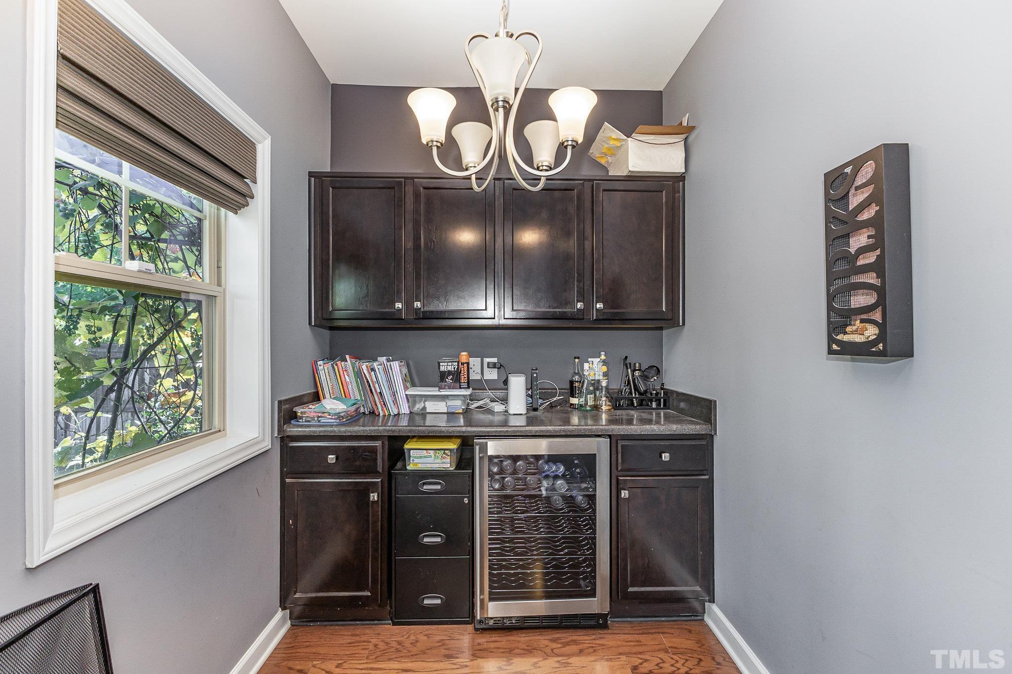 1604 Hauser Lake Road Knightdale, NC 27545 - Photo 15 of 32 a kitchen with stainless steel appliances granite countertop a stove and a wooden floors